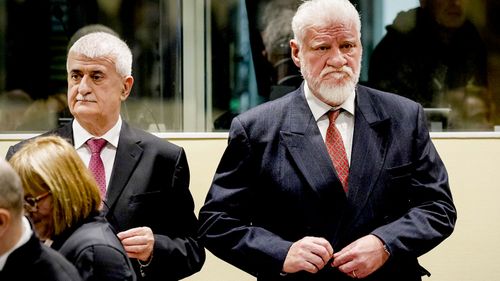 Bruno Stojic and Slobodan Praljak enter the Yugoslav War Crimes Tribunal in The Hague. (AAP)