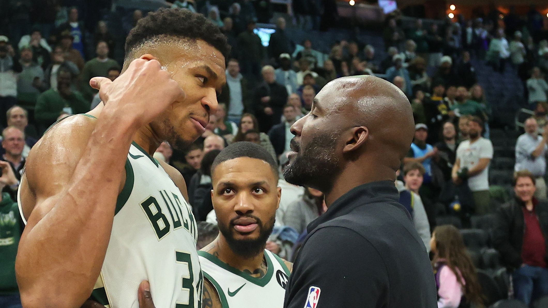 Giannis Antetokounmpo exchanges words with Tyrese Haliburton of the Indiana Pacers.