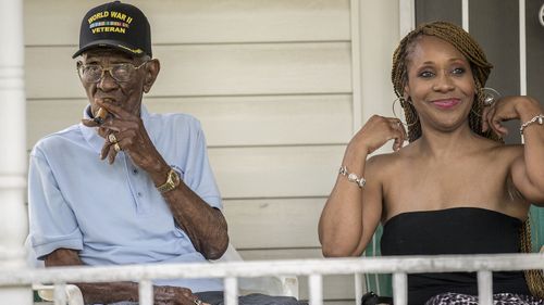 Richard Overton, left, smokes a cigar with friend Donna Shorts