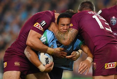 Will Hopoate gets crunched by the Maroons defence.