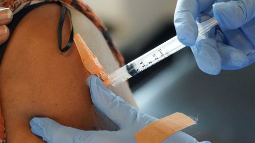 US health staff shortages as coronavirus vaccine mandates take effect.