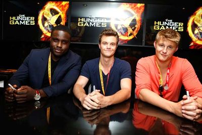 <i>Hunger Games</i> hotties Dayo Okeniyi, Jack Quaid and Alexander Ludwig at a DVD signing.