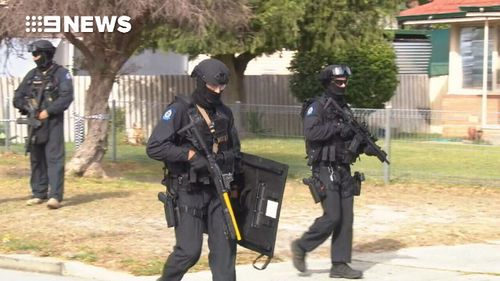 This afternoon heavily-armed officers surrounded a property on Wingrove Road in Langford.