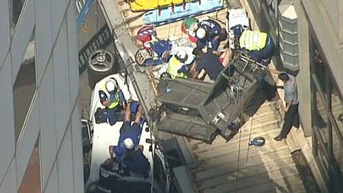 Paramedics worked to treat the two men. (9NEWS)