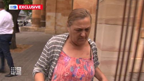 A South Australian grandmother jailed for covering up the murder of her son's fiancé has been handed over to the border force amid an order that she be deported.