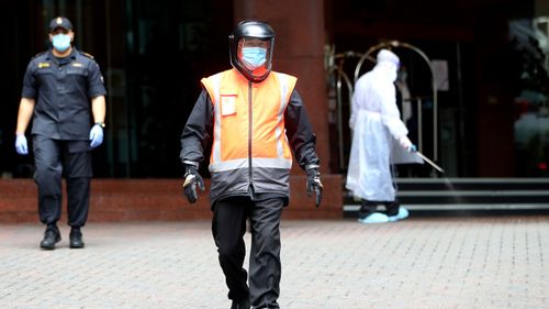 Security guards patrol the outside of Stamford Plaza on July 10, 2020 in Auckland, New Zealand.