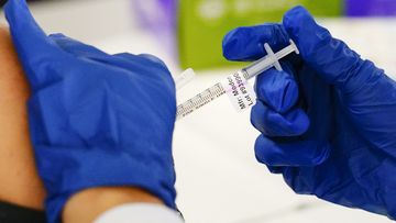 FILE - A health worker administers a dose of a Moderna COVID-19 vaccine during a vaccination clinic in Norristown, Pa. on Dec. 7, 2021. In a reversal for President Joe Biden, a federal appeals court in New Orleans on Monday, June 27, 2022, agreed to reconsider its own April ruling that allowed the administration to require federal employees to be vaccinated against COVID-19. (AP Photo/Matt Rourke, File)