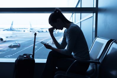 Stressed woman in the airport.