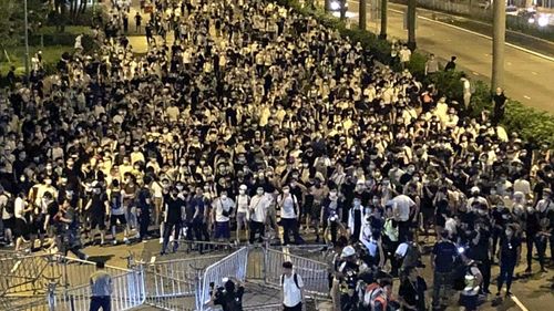 Hong Kong citizens march through the streets in a massive protest against China's extradition law.