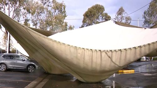 Shade cloths in the car park at Westfield Mt Druitt have been completely filled with rain during the downpour.