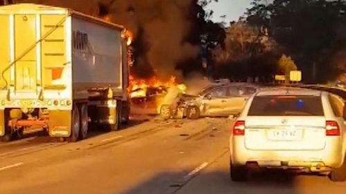 This week, a B-double truck crashed into four cars on the M1, causing them to burst into flames. Picture: 9NEWS.