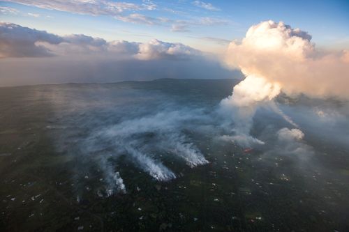 The volcano eruption sends a huge plume of gas and smoke skyward. (AAP)