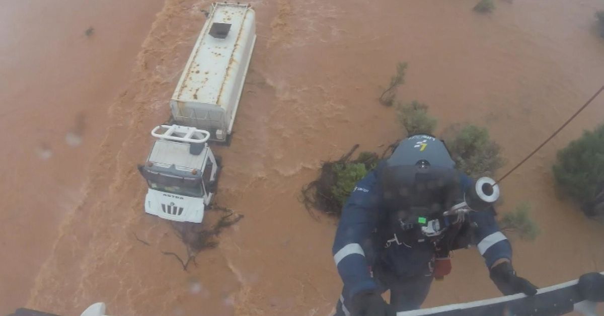 Dramatic moment truckie plucked to safety in outback floods