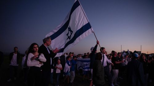 People gather for a Jewish vigil in Support of Israel at Rodney Reserve in Dover Heights on October 11, 2023.