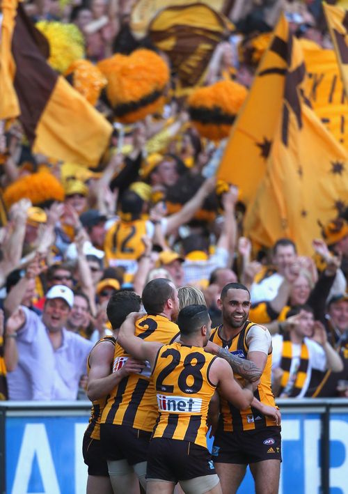  Will Langford of the Hawks is congratulated by team mates after kicking a goal. (Getty)