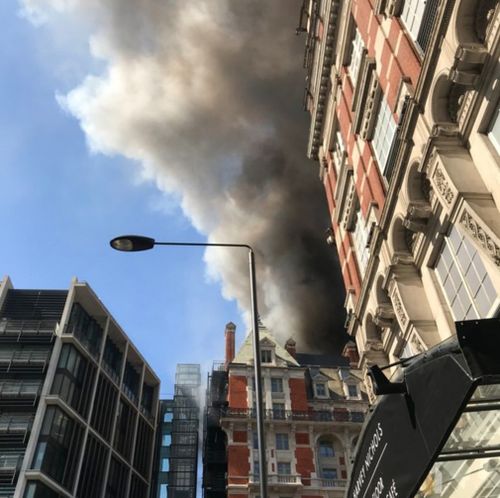 Thick black smoke can be seen covering the Knightsbridge area. (Twitter)