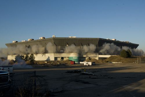 Detonations can be seen during an attempted implosion of the Silverdome. (AAP)