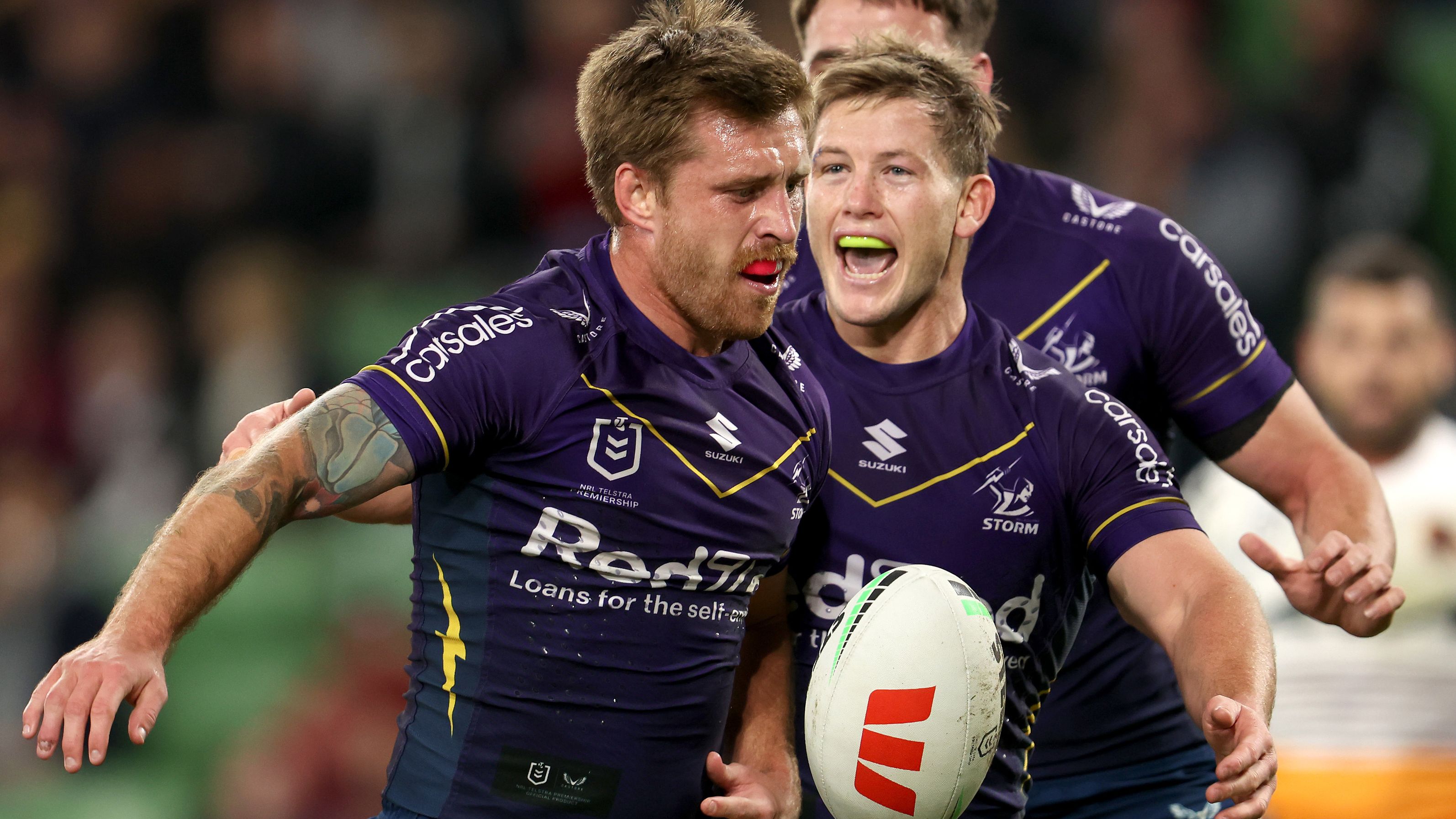 Cameron Munster of the Storm celebrates with teammates.