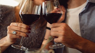 Woman and man drinking wine together