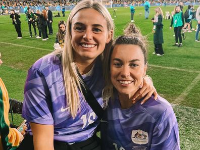 Mackenzie Arnold with her partner and fellow footballer Kirsty Smith.