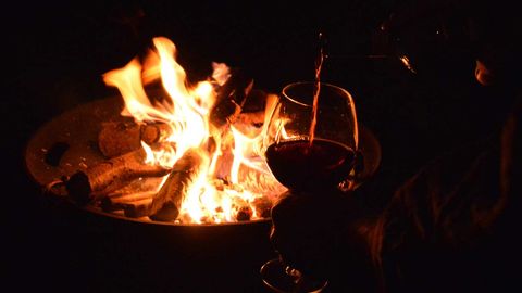 Red wine, bonfire stock image