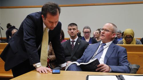 Defense attorney John Dakmak, left, talks with Criminal Division Lead Trial Attorney Bill Rollstin in court on Tuesday. (AP)