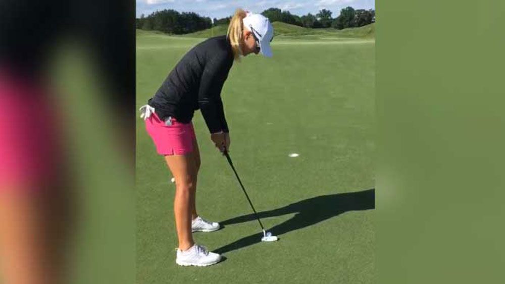 Golf pro takes long approach with trick putt