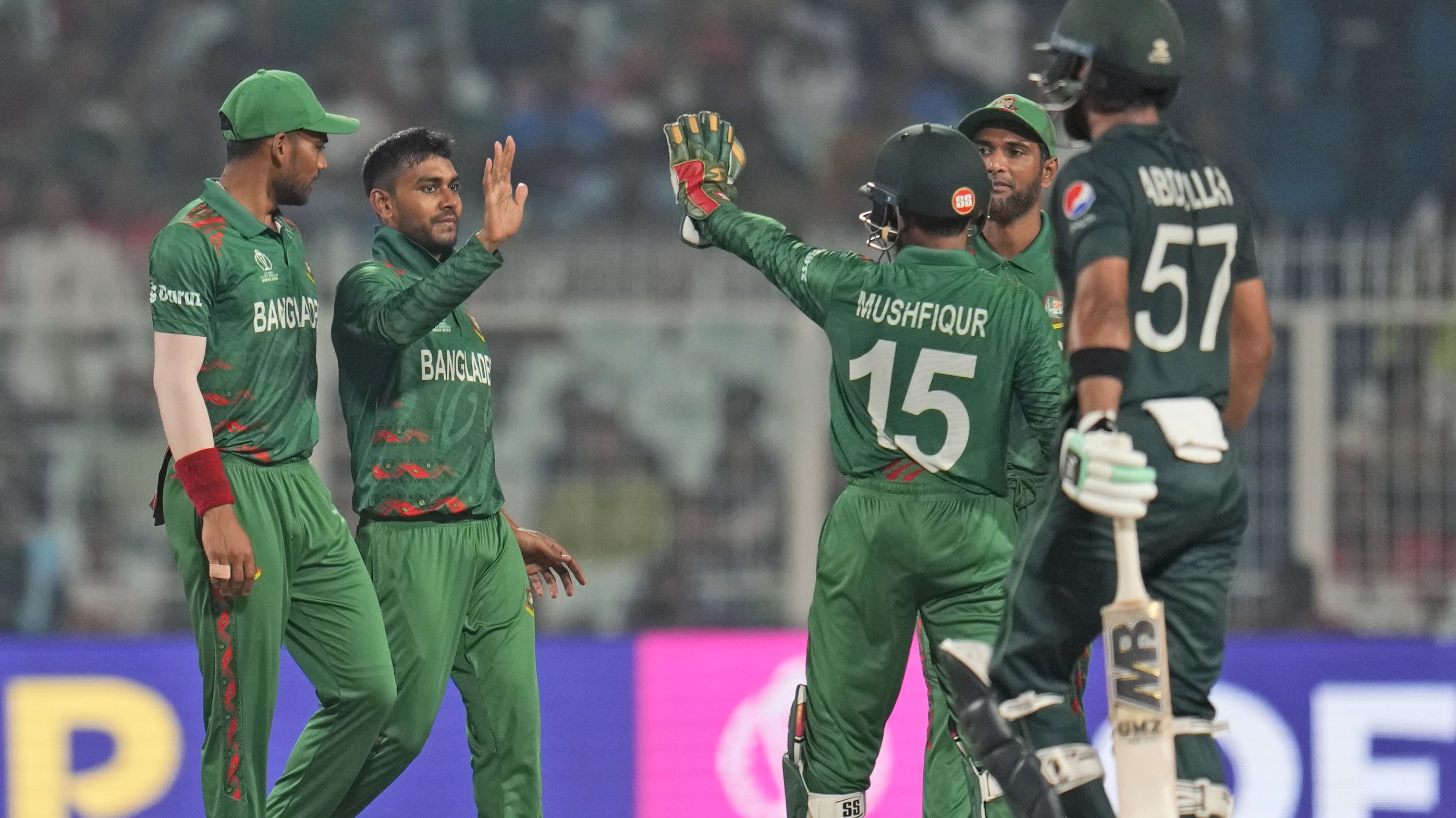 Bangladesh&#x27;s Mehidy Hasan Miraz celebrates with teammates the wicket of Pakistan&#x27;s Abdullah Shafique.