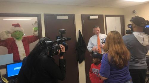 "The Grinch" being kept in a police holding cell. (Facebook/TeDera Dwayne Graves II)