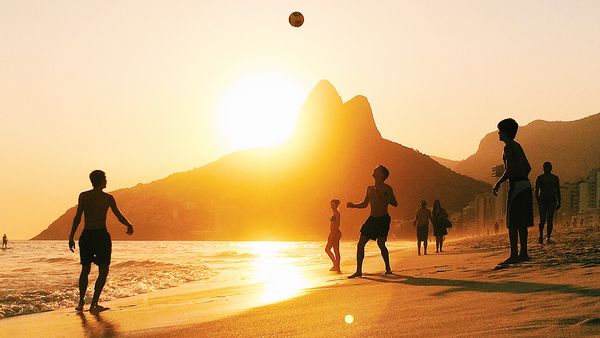 People playing football on Ipanema beach (Getty)