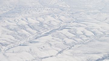 Snow Covered Verkhoyansk Mountains in northern Siberia, Sakha Republic, Russia.