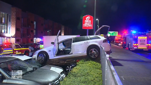 The out-of-control vehicle ploughed into the hotel carpark and landed on two parked vehicles.