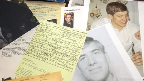 Photos, a driver's license, a death notice and other items from a 1969 robbery involving Ted Conrad are shown at a US Courthouse in Cleveland. 