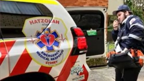 Rabbi Yanky Super using his emergency services radio