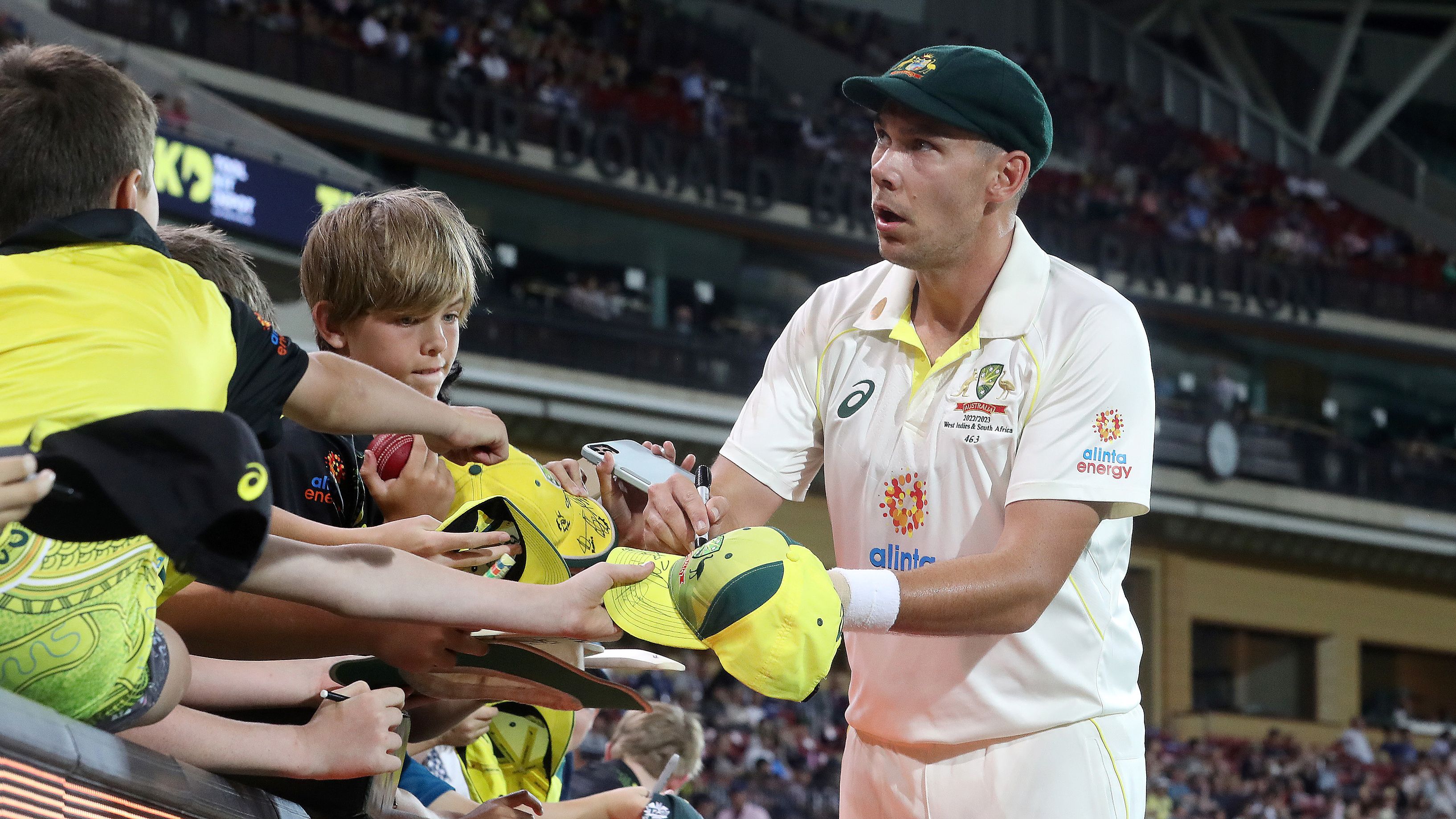 Scott Boland of Australia signs autographs during day three of the Second Test Match in the series between Australia and the West Indies at Adelaide Oval on December 10, 2022 in Adelaide, Australia. (Photo by Sarah Reed - CA/Cricket Australia via Getty Images)