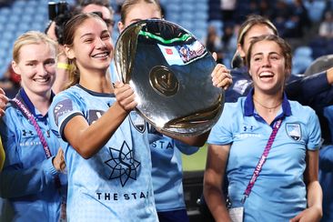 Indiana Dos Santos holds aloft the Premier&#x27;s Plate after the round 20 A-League Women&#x27;s match between Sydney FC and the Newcastle Jets.