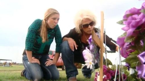 Sandy and Saige at the grave. 