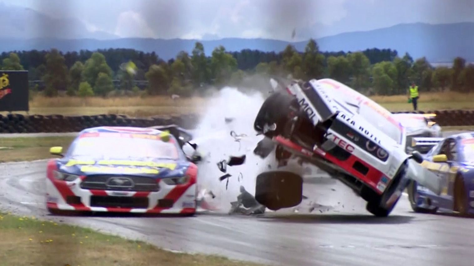 James Simpson&#x27;s Dodge Challenger gets airborne after hitting the back of the stationary Ben Grice Ford Mustang.