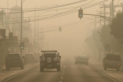 Thick smoke hangs over the town of Orbost, Australia. Two people are dead and 28 remain missing following bushfires across the East Gippsland area, with Victorian premier Daniel Andrews declaring a state of disaster in the region. Thousands of people remain stranded in the coastal town of Mallacoota and are being evacuated by navy ships to Melbourne.