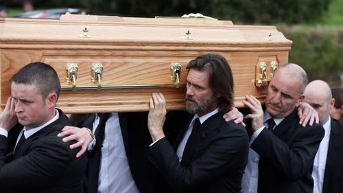 Carrey helped family members carry Ms White's coffin through the town. (AAP)