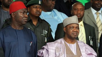 Nigeria&#x27;s Vice President Namadi Sambo (R) and Deputy President of the Senate Ike Ekweremadu stand for the national anthem during the national inter-denominational funeral rites of Nigeria&#x27;s secessionist leader Odumegwu Ojukwu at Michael Opkara Square in Enugu, southeastern Nigeria, on March 1, 2012. Soldiers fired a 21-gun salute at the funeral of Odumegwu Ojukwu on Thursday as Nigerian leaders paid final respects to the man whose 1967 declaration of Biafran independence sparked a civil war. For