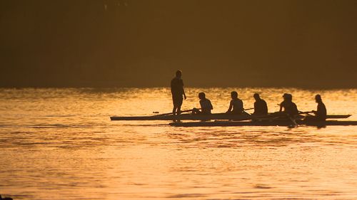 Rowers beating the heat on Albert Park Lake this morning. 