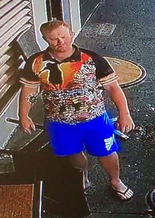 The man was seen wearing a black polo shirt with an aboriginal art print. (NSW Police)