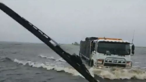 A truck steers through the flooded roads of Broome. (James Weeding via Facebook)