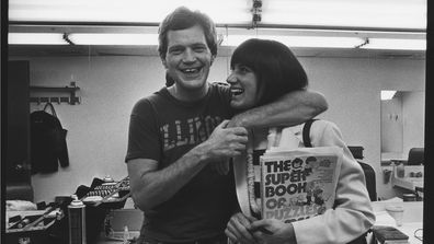 David Letterman poses in his dressing room with girlfriend Merrill Markoe during a 1982 photo portrait session in New York City, New York. 