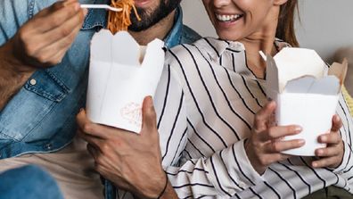 Couple eating takeaway