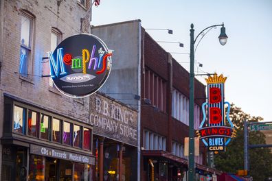 Memphis, TN, USA - June 25, 2017: View of music clubs and retail establishments lining the famous tourist district of Beale Street in downtown Memphis, TN at dusk.  Beale Street is on the U.S. National Register of Historic Places.