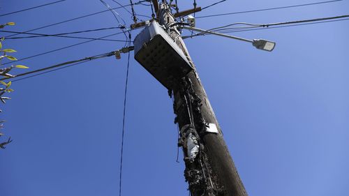 An image captures of the aftermath of the first time the 5G telegraph pole was est on fire in the Sydney suburb of Vaucluse.  