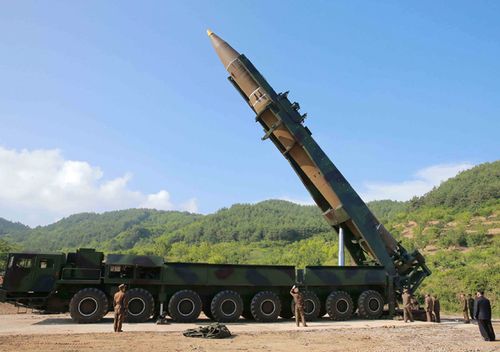 This picture taken and released on July 4, 2017 by North Korea's official Korean Central News Agency (KCNA) shows Kim Jong-Un inspecting the test-fire of the intercontinental ballistic missile Hwasong-14 at an undisclosed location. (AFP PHOTO/KCNA VIA KNS)