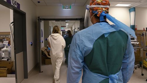 Emergency Department staff with a patient in St Vincent's Hospital Emergency Department red zone.